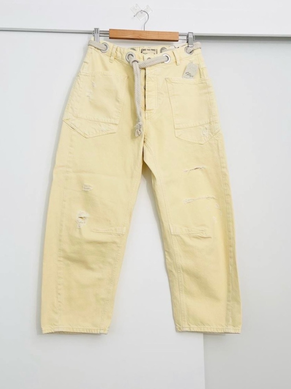 We The Free Moxie soft yellow jeans with rope tie.